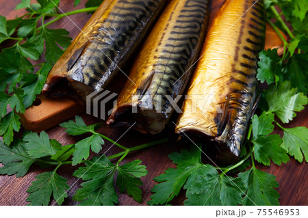 Tasty hot smoked mackerel with greens on wooden surface Tasty hot smoked mackerel with greens on wooden surface 75546953