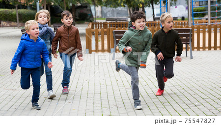 Children running on playground 75547827