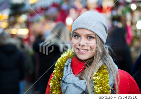 Woman posing on Christmas market Woman posing on Christmas market 75548510