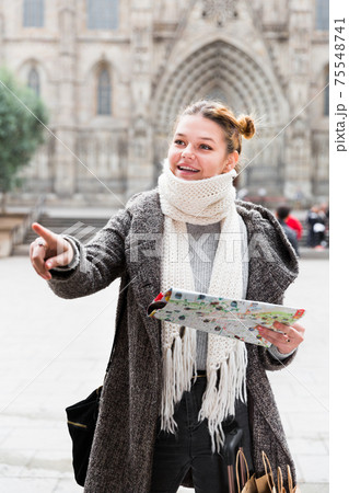 young female in scarf with map young female in scarf with map 75548741