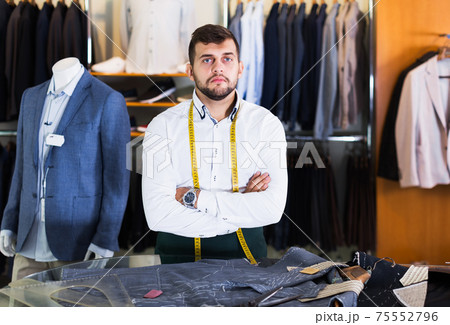 Male tailor posing in workshop Male tailor posing in workshop 75552796