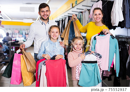 Family after shopping in store Family after shopping in store 75552937