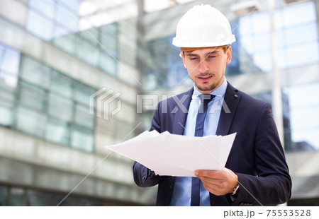 Portrait of cheerful man working outdoors Portrait of cheerful man working outdoors 75553528