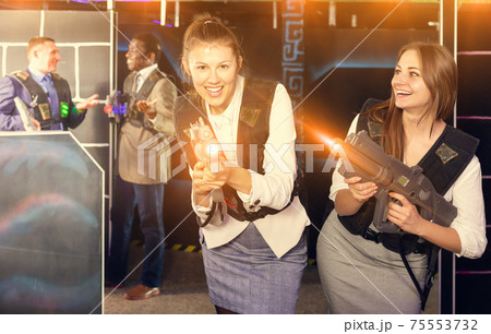 Two women having corporative entertainment Two women having corporative entertainment 75553732