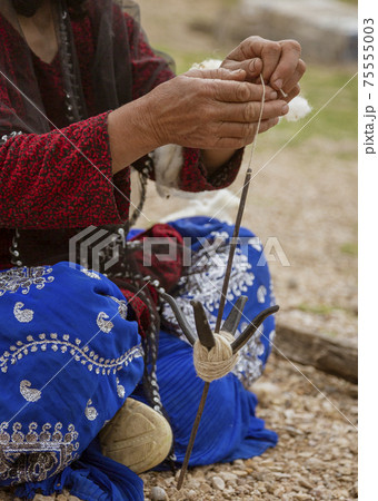 Iranian Hill Tribe Woman Spins Goat Wool - Close-up 75555003