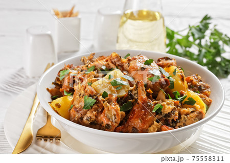 braised Rabbit with potatoes in a white bowl braised Rabbit with potatoes in a white bowl 75558311