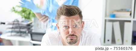 Man in medical office at proctologist closeup 75560376