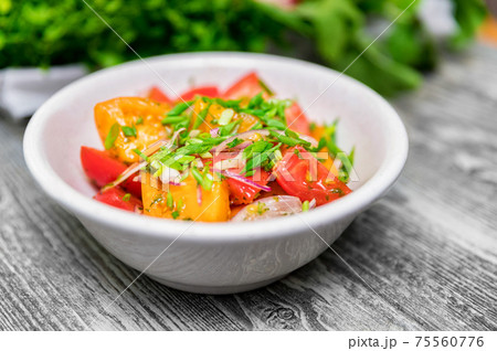 Fresh rustic vegetable salad on rustic background Fresh rustic vegetable salad on rustic background 75560776