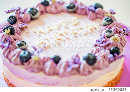 Close up birthday cake with cream and blueberries 75560823