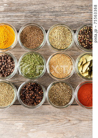 Various kinds of colourful seasonings in bowls. Collection of spices Various kinds of colourful seasonings in bowls. Collection of spices 75563368
