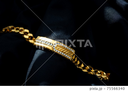 gold with diamond bracelet isolated on black background 75566340