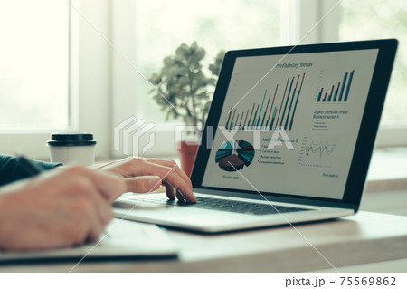 close up. business man works analyzing financial tables . 75569862