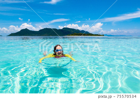 Kids snorkel. Children snorkeling in tropical sea. Kids snorkel. Children snorkeling in tropical sea. 75570534