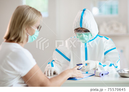 Coronavirus outbreak. Doctor and covid-19 patient. 75570645
