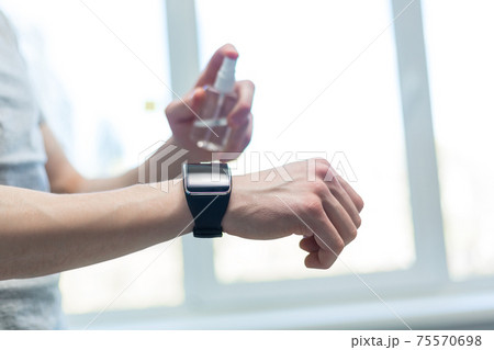 smart watch on the hand of a young man. 75570698