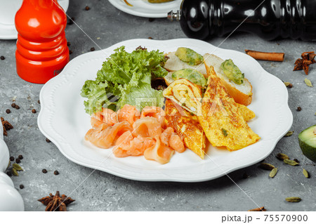 omelet with red fish and vegetables, beautiful serving omelet with red fish and vegetables, beautiful serving 75570900