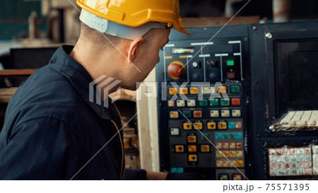 Skillful factory engineer or worker do machine job in manufacturing workshop Skillful factory engineer or worker do machine job in manufacturing workshop 75571395