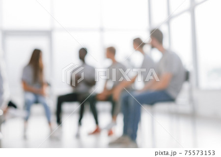 background image of a group of young people at a meeting in a conference room 75573153