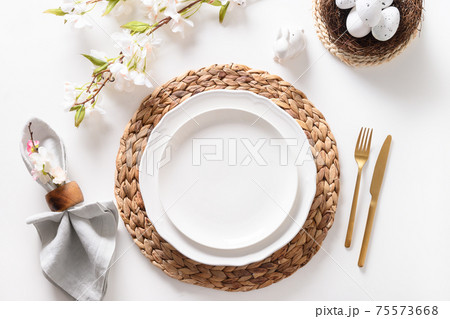 Easter table setting with blooming apple flowers on white table. 75573668