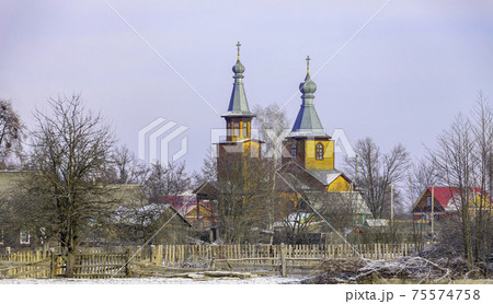 View of the outskirts of a Belarusian village in January after a morning snowfall. 75574758