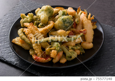Japanese vegetable tempura on black plate Japanese vegetable tempura on black plate 75577140