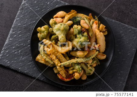 Japanese vegetable tempura on black plate Japanese vegetable tempura on black plate 75577141
