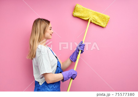 side view on young housewife cleaning wall side view on young housewife cleaning wall 75577380