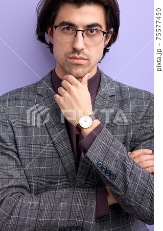 confident caucasian guy seriously looking at camera in eyeglasses 75577450