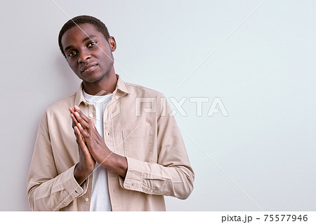 confident black guy in casual jacket looking seriously, thinking 75577946
