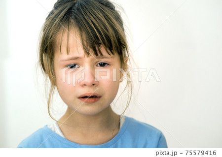 Closeup portrait of sad crying child girl. 75579416