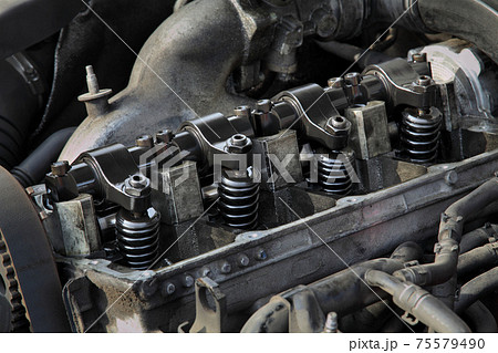 Closeup of modern diesel engine cylinder head with injectors 75579490