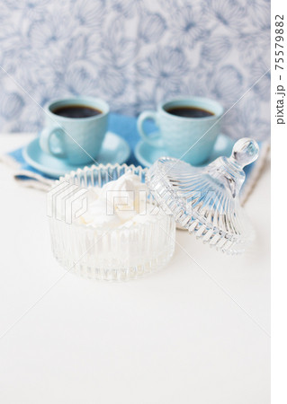 saucer with marshmallows in the background two cups of coffee 75579882