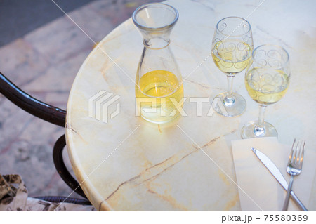 White wine in a liter bottle on a table in a cafe 75580369