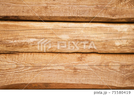 Old natural uncolored wooden wall surface. Background photo texture 75580419