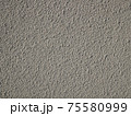 Detail of bumpy concrete wall painted in gray color 75580999