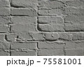 Detail of old brick exterior many times painted wall, gray color 75581001