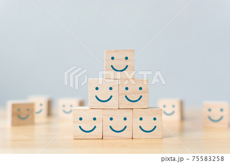 Wooden cube block shape with icon face smiley 75583258