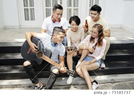 Friends having fun at a party Friends having fun at a party 75585737