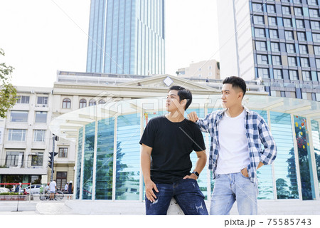 Men standing in the city 75585743