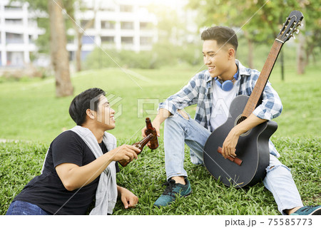 Friends resting outdoors Friends resting outdoors 75585773