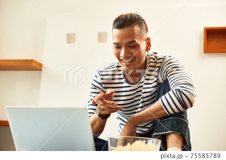 Man watching comedy movie 75585789