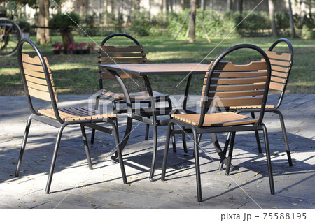 Empty Table and chairs at back yard. Set of furniture Empty Table and chairs at back yard. Set of furniture 75588195
