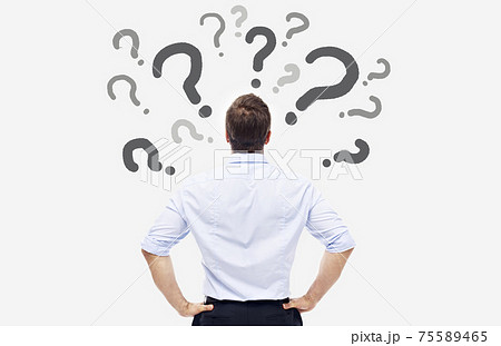 rear view of a caucasian business person looking at the question marks on white board 75589465