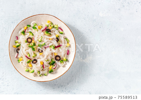 Konjac pasta with broccoli, shot from above with a place for text 75589513
