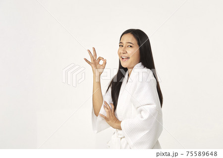 Beautiful girl wearing white bathrobe 75589648