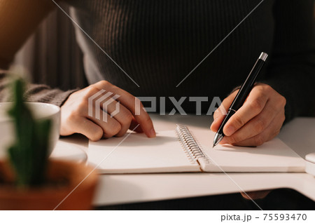 businessman hand working with new modern computer and writing on the notepad strategy diagram 75593470