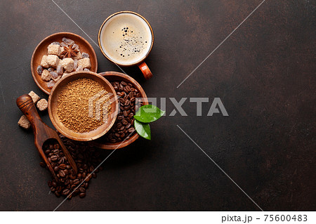 Roasted coffee beans, ground powder and espresso cup Roasted coffee beans, ground powder and espresso cup 75600483