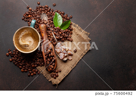 Roasted coffee beans, brown sugar and espresso cup 75600492