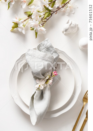 Easter dinner with blossom flowers on white. 75601532