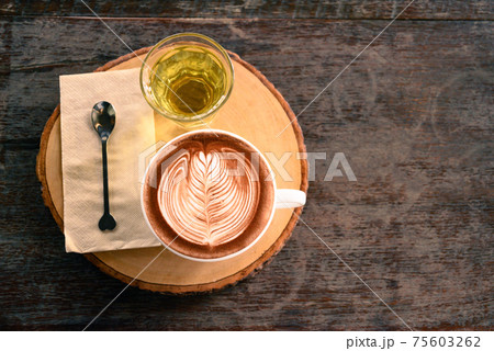 Cup of chocolate art and hot tea on wooden table, Top view 75603262